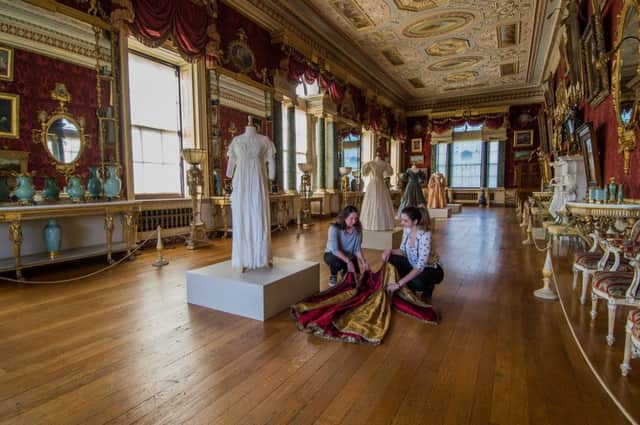 Alexis Guntrip and Lucy Allen, arranging Victoria's coronation robes.