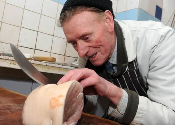 Butcher Frank Fisher is still running his own business at 86. Picture: Ross Parry Agency