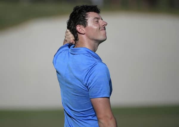 Rory McIlroy, of Northern Ireland, reacts after making a bogey on the 18th green during the final round of the Arnold Palmer Invitational golf tournament in Orlando. (AP Photo/Phelan M. Ebenhack)