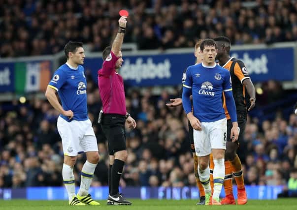 Hull City's Tom Huddlestone (not pictured) is shown the red card.