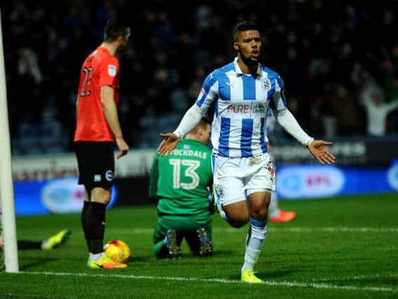 Elias Kachunga celebrates Huddersfield's third goal against Brighton
