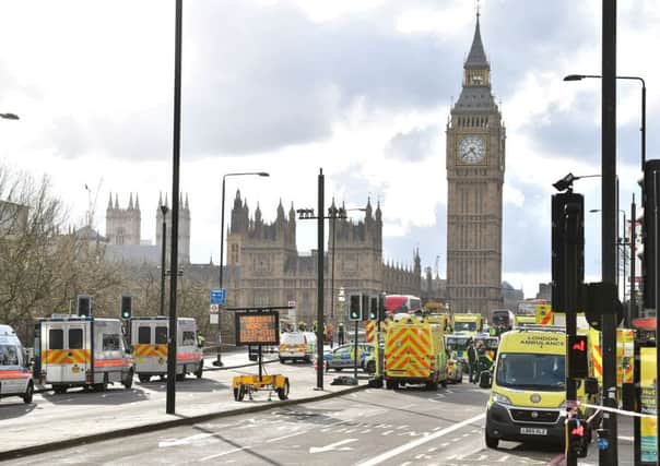 Emergency personnel on Westminster Bridge, close to the Palace of Westminster, London.  Photo: Dominic Lipinski/PA Wire