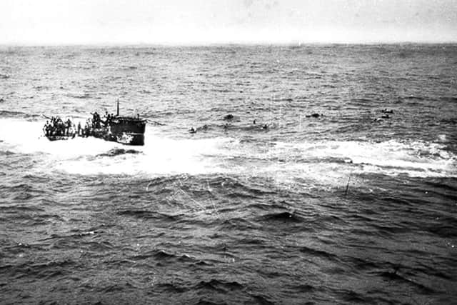 Crewmen of a German submarine U-boat abandoning ship in the Atlantic Ocean after being depth charged in 1944. (AP).