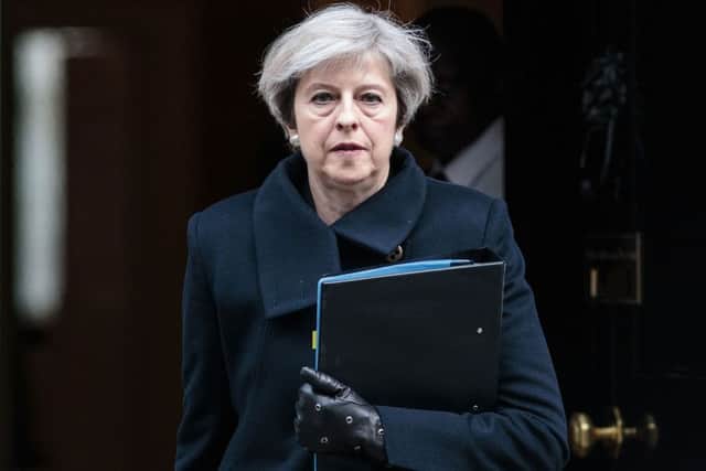 Theresa May leaves 10 Downing Street after this morning's arrests