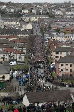 The coffin of Northern Ireland's former deputy first minister and ex-IRA commander Martin McGuinness is carried down Westland Street into the Bogside ahead of his funeral