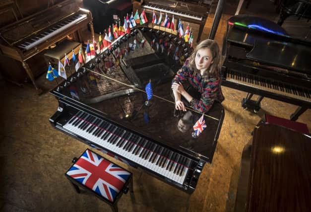Artist Ruth Spencer Jolly who composed 'European Unison' an ensemble written for 28 pianos, representing the members of the European Union and symbolising Brexit, following a preview of her work at Besbrode Pianos in Leeds. PRESS ASSOCIATION Photo. Picture date: Thursday March 23, 2017. The composition tells the story of the EU from its birth to Brexit. The ensemble of pianos is a metaphor demonstrating "the whole is greater than the sum of its parts". Photo: Danny Lawson/PA Wire