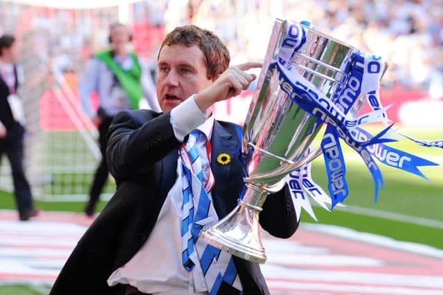 Dean Hoyle celebrates Huddersfield's promotion to the Championship in 2012.
