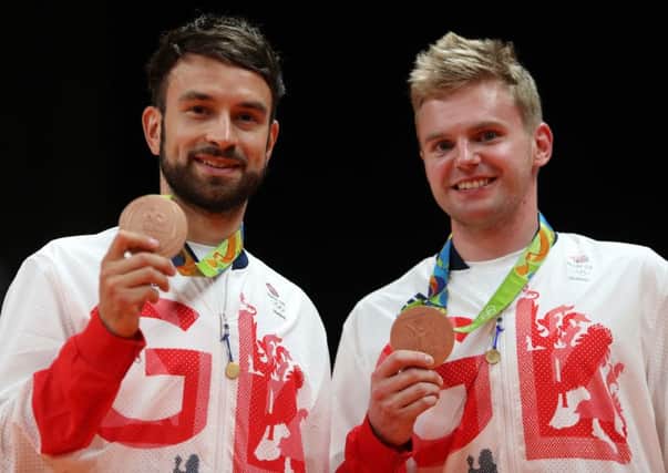 CASH BOOST: Elite players such as Olympic bronze medallists Marcus Ellis and Chris Langridge lost funding but badminton is to receive Â£10m-plus.