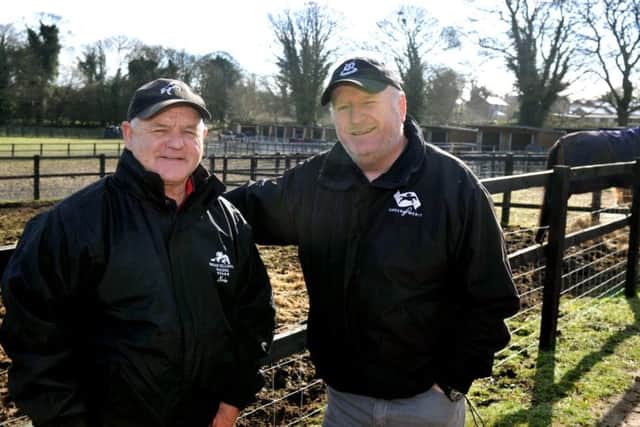 Definitly Red's trainer Brian Ellison, left, with the horses owner Phil Martin.