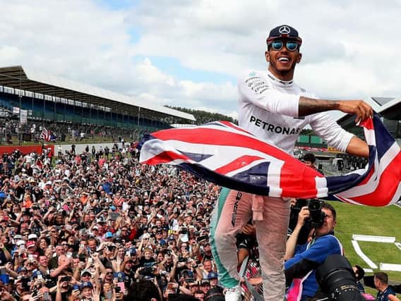 Lewis Hamilton celebrates victory at the 2016 British Grand Prix (Photo: PA)