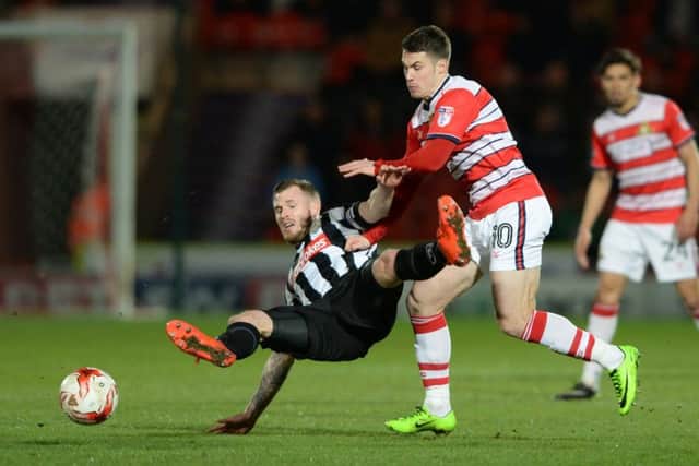 Doncaster Rovers midfielder Tommy Rowe is keen to clinch a third promotion to add to previous successes with Peterborough and Wolves (Picture: Bruce Rollinson).
