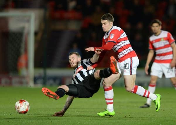 Doncaster Rovers midfielder Tommy Rowe is keen to clinch a third promotion to add to previous successes with Peterborough and Wolves (Picture: Bruce Rollinson).