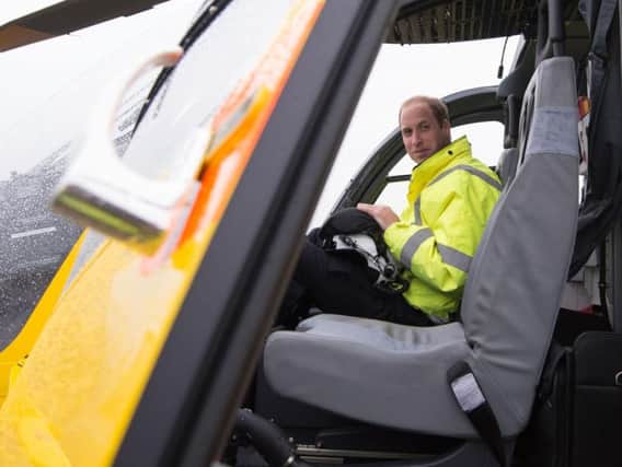 The Duke of Cambridge sitting in the cockpit of an East Anglian Air Ambulance helicopter. (Photo: Stefan Rousseau/PA Wire)