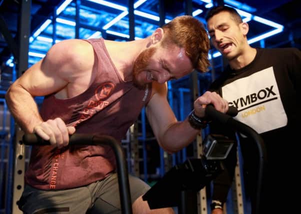 George Edwards (left) and Firas Iskandarani attending 'Flatline', which is described as the hardest and deadliest gym class in the world, at a Gymbox club in London, as the fitness chain is exploring options to expand outside the capital and internationally for the first time. Picture: Matt Alexander/PA Wire
