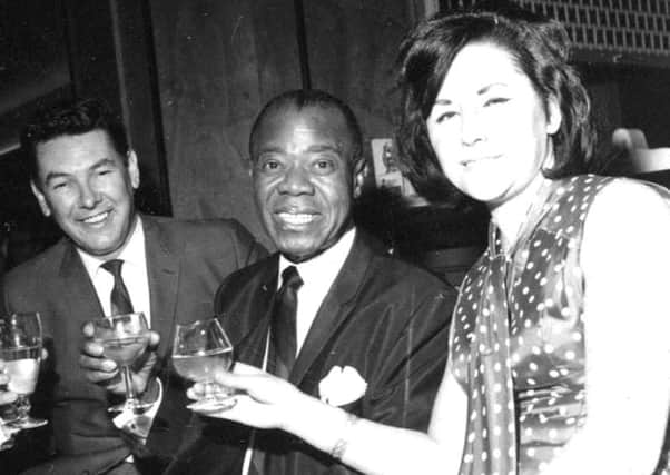 James Corrigan, left, with Louis Armstrong and James's wife Betty pictured in 1968 when the jazz legend played at Batley.