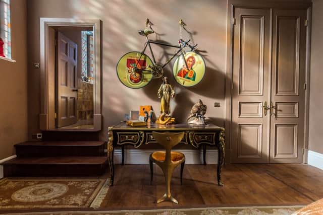 The bike on the wall of Mark's bedroom is one of his favourite pieces of contemporary art