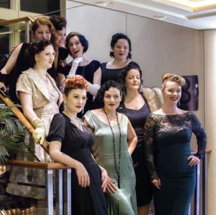 The House of Foxy's customer volunteer models, with Clare in the middle at the top, showcasing designs in a show last month on a vintage themed cruise by P&O from Hull to Rotterdam.