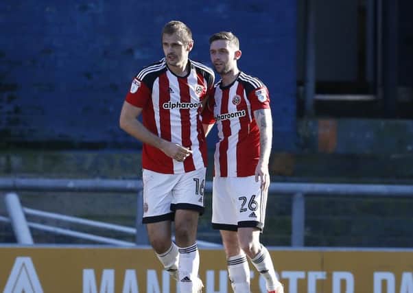 James Hanson of Sheffield Utd celebrates with goal scorer Jay O'Shea of Sheffield United during the English League One match at the SportsDirect.com Stadium, Oldham. (Picture: Simon Bellis/Sportimage)