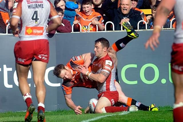 Castleford player Joel Monaghan scores a try.