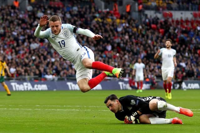 England's Jamie Vardy jumps over Lithuania's Ernestas Setkus after a chance on goal during the World Cup Qualifying match at Wembley Stadium, London. (Picture: Adam Davy/PA Wire)