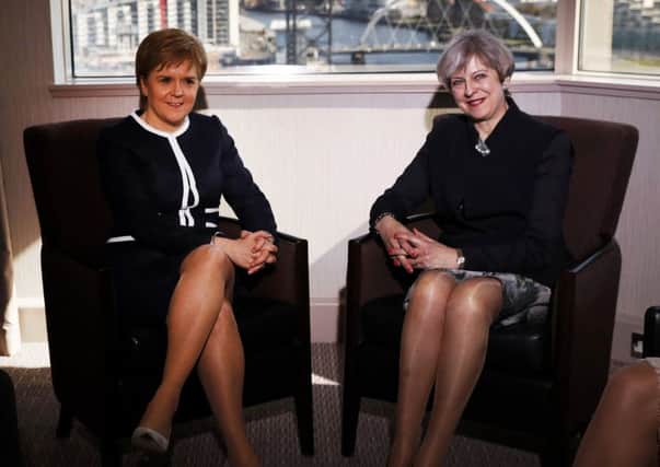 Prime Minister Theresa May (right) and First Minister Nicola Sturgeon meet at the Crowne Plaza hotel in Glasgow, to take part in a bilateral meeting during Mrs May's visit to Scotland.
Picture: RUSSELL CHEYNE/PA Wire