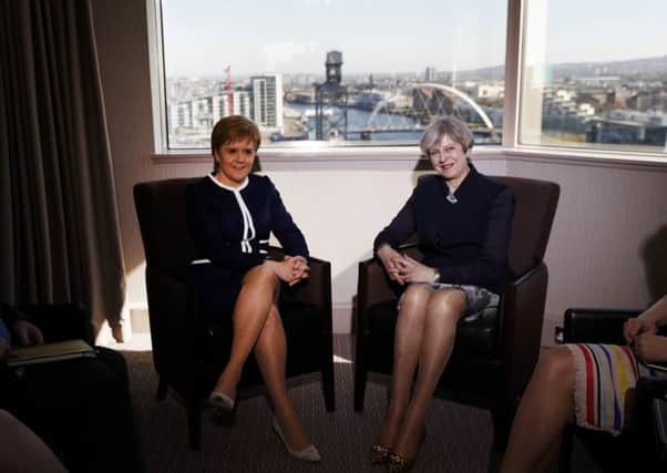 Prime Minister Theresa May (right) and First Minister Nicola Sturgeon meet at the Crowne Plaza hotel in Glasgow, to take part in a bilateral meeting during Mrs May's visit to Scotland. RUSSELL CHEYNE/PA Wire