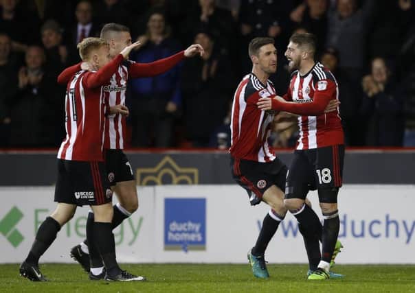 Sheffield United celebrate after Kieron Freeman scored their second goal against Millwall last night (Picture: Simon Bellis/Sportimage).