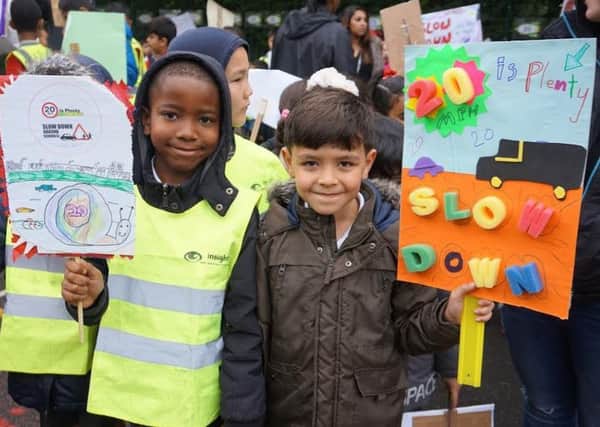CAMPAIGN: Children from Burley St Matthias Primary School in Leeds holding up road safety placards.