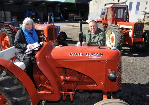 Janice Walker and her brother Barry Walker at Thorpe Farm, Great Smeaton with some of the vintage tractors that will be up fore sale.  Pictures by Gary Longbottom.