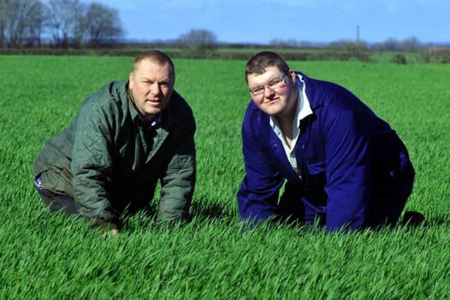 Barry Walker and his son Tommy in the fields at Thorpe Farm, Great Smeaton.