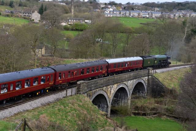 The Flying Scotsman crosses Mytholmes viaduct at Haworth, on its  journey from Oxenhope to Carlisle to celebrate the re-opening of the Settle Carlisle Railway line.  Picture: Bruce Rollinson