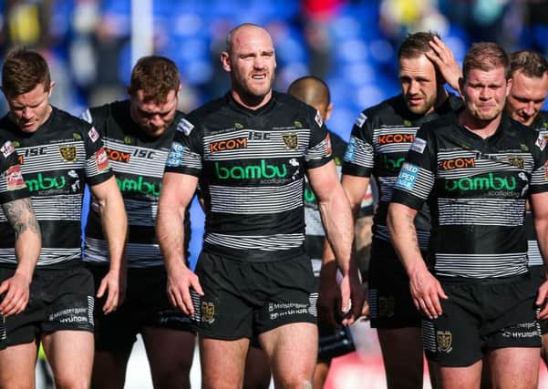 Hull FC players look dejected after letting slip their lead to draw the game. Picture: Alex Whitehead/SWpix.com