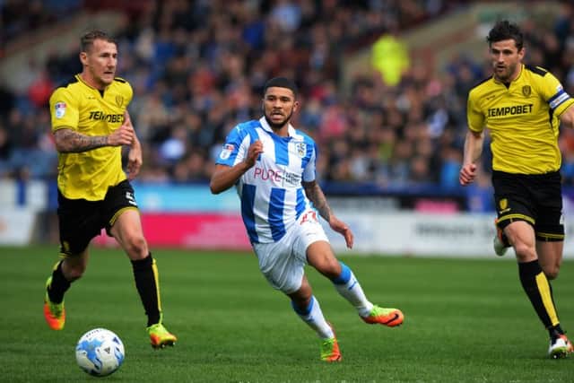 FRUSTRATING DAY: Nahki Wells gets away from Kyle McFadzean and John Mousinho.  Picture: Bruce Rollinson