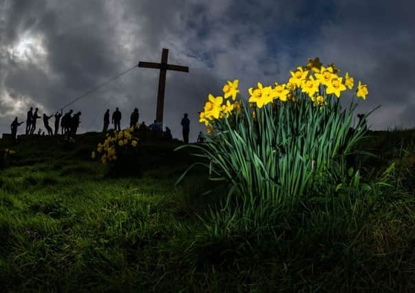 The rising of the easter Cross at Otley Chevin.
