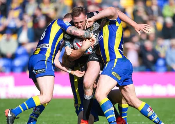Hull FC's Liam Watts is tackled by Warrington's Kevin Brown and Ben Westwood. Picture by Alex Whitehead/SWpix.com