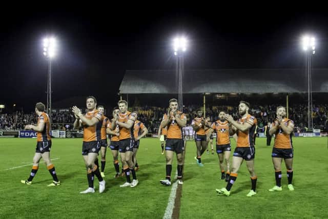 Castleford celebrate victory over Huddersfield to their fans. Picture: Allan McKenzie/SWpix.com