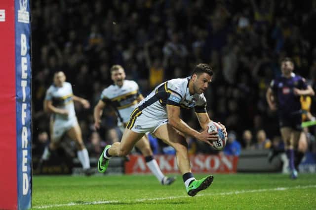 Joel Moon scores a try in Friday night's win over Wigan at Headingley. Picture: Steve Riding.