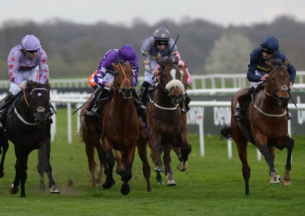 Bravery, ridden by Danny Tudhope, right, wins the Betway Lincoln Heritage Handicap at Doncaster (Picture: PA).