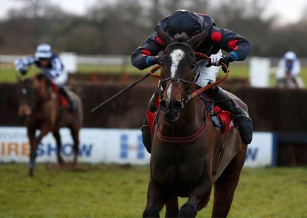 One For Arthur, ridden by Derek Fox, pulls away from the last fence before going on to win the Betfred Classic Handicap at Warwick in January (Picture: Julian Herbert/PA Wire).