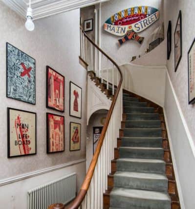Jonny Hannah's prints feature heavily in the hall and on the stairway