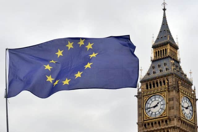 An EU flag flies in front of the Houses of Parliament in Westminster, London.