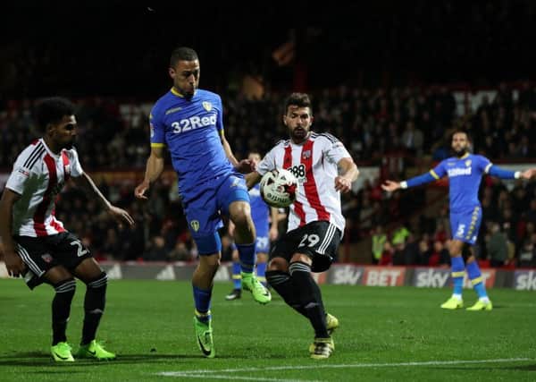 Leeds United's Kemar Roofe holds off Yohan Barbet, of Brentford, but his shot went wide (Picture: Picture Bruce Rollinson).