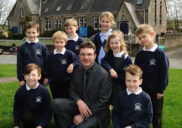 Andrew Phoenix , headteacher of Hampsthwaite Primary School, near Harrogate, with pupils. Picture Jonathan Gawthorpe.