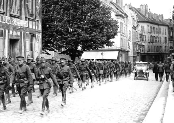 history boys: American troops march through a town in the Meuse region, France, October 1918.  (PA).