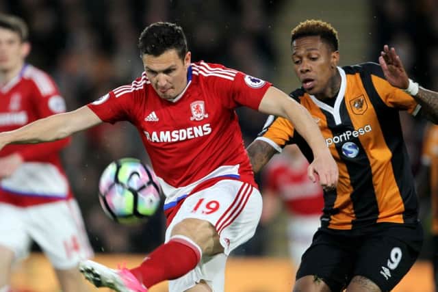 Middlesbrough's Stewart Downing (left) and Hull City's Abel Hernandez battle for the ball.