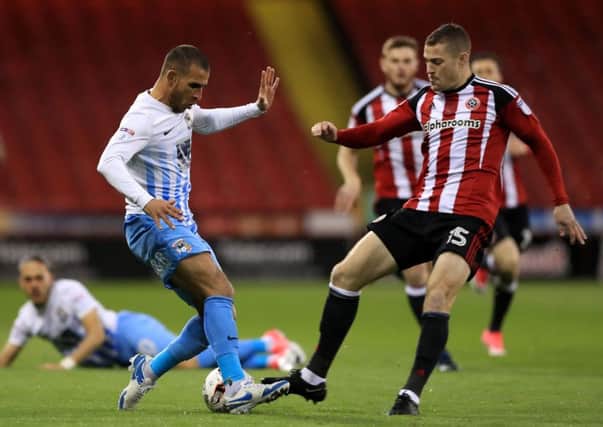 Coventry City's Marcus Tudgay (left) and Sheffield United's Paul Coutts