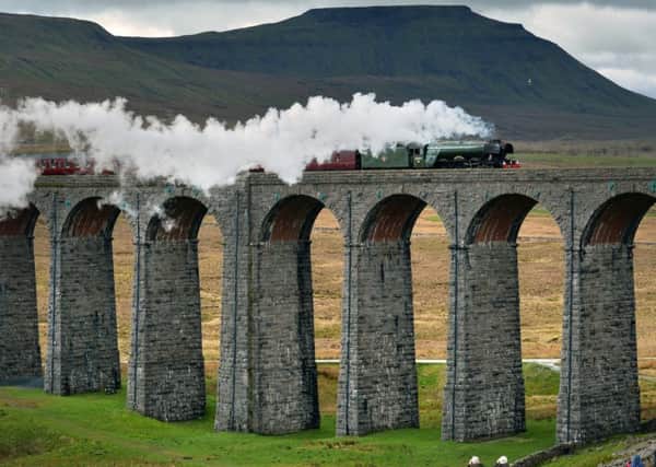 The Flying Scotsman crossing the Ribblehead Viaduct, on its  journey from Oxenhope to Carlisle to celebrate the re-opening of the Settle to Carlisle railway.