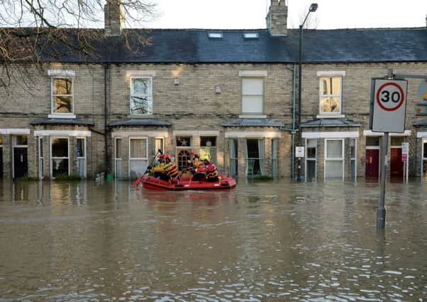 Mountain rescue teams in a flooded York street in December 2015.