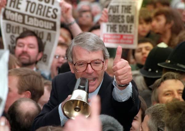 John Major tries to drown out the jeers during the 1992 general election.