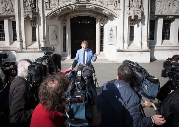 Jon Platt speaks to the media outside the Supreme Court in London, where he lost a court battle over taking his daughter on holiday to Disney World during school term-time.